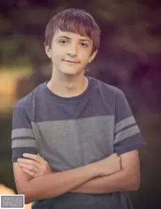 Photo of me around the time I received an autism diagnosis. I may have been shy, but social interactions were and still are important to me as part of my autism diagnosis.