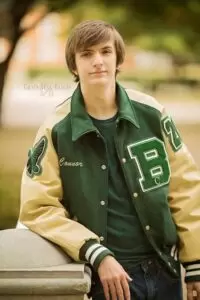 Photo of me as a senior in high school, following my autism diagnosis. I am proud of earning my letter jacket with volunteering and playing tennis. These are a few tidbits about me and my autism diagnosis.